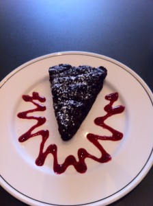 Flourless chocolate cake with raspberry coulis