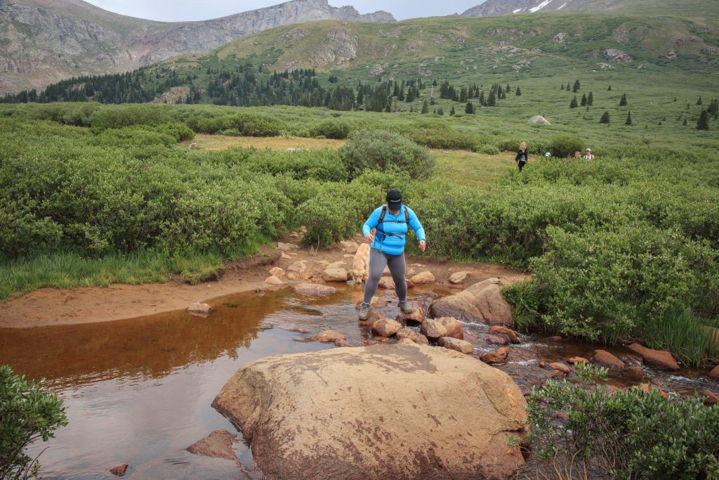 Towards the start of the trailhead, hikers must cross over rocks on a creek. Wear good shoes!