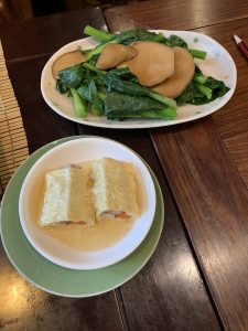 Tofu-wrapped dim sum and Chinese vegetables.
